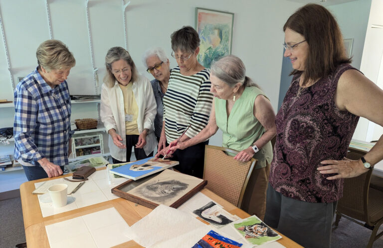 Residents looking at art work